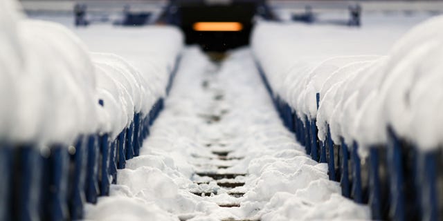 Snow covers seats and walkways at Highmark Stadium prior to a game between the Miami Dolphins and the Buffalo Bills Dec. 17, 2022, in Orchard Park, N.Y.