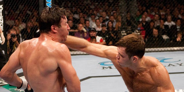 (L-R) Forrest Griffin punches Stephan Bonnar at UFC 62 at the Mandalay Bay Events Center on August 26, 2006, in Las Vegas, Nevada. 