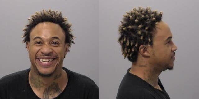 Former Disney Channel star Orlando Brown smiles for the camera in his mug shot.