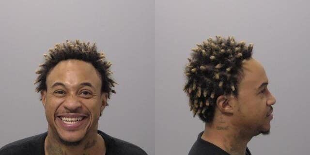 Former Disney Channel star Orlando Brown smiles for the camera in his mug shot.