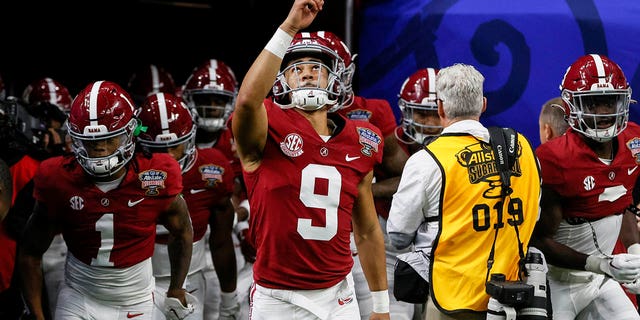 Alabama quarterback Bryce Young (9) leads the team onto the field before the start of the NCAA Sugar Bowl college football game against Kansas State on Saturday, December 31, 2022 in New Orleans.