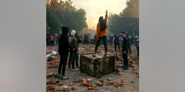 Demonstrators in Iran protest in the streets.