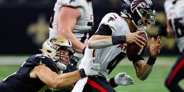New Orleans Saints linebacker Kaden Elliss (55) sacks Atlanta Falcons quarterback Desmond Ridder (4) in the second half of an NFL football game in New Orleans, Sunday, Dec. 18, 2022.