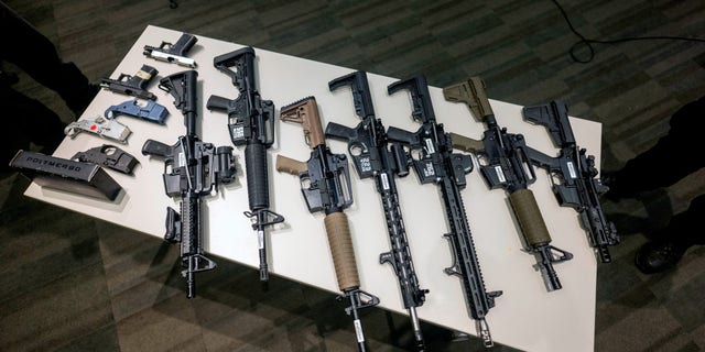 Seized ghost guns on display at LAPD Headquarters during a news conference to announce a reward program focused on getting unserialized ghost guns off the street.