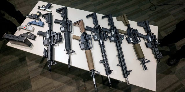 Seized ghost guns on display at LAPD Headquarters during a news conference to announce a reward program focused on getting unserialized ghost guns off the street.