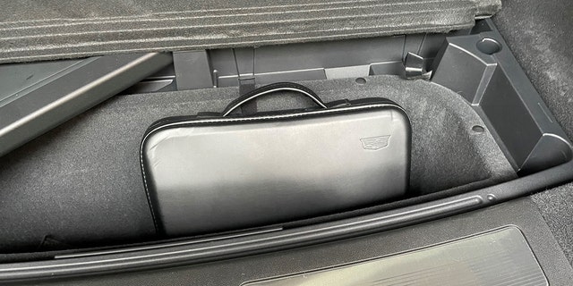 A portable charging cable is stored in an attache-style case under the cargo area floor along with a removable cargo cover. 