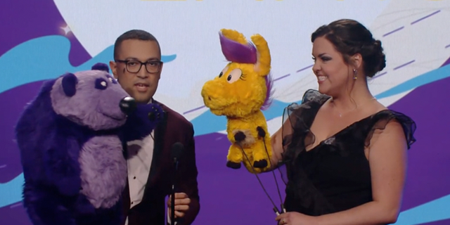 Two performers utilizing puppets announce an award for gay teen romance "Heartstopper" at the first annual Children's and Family Emmy awards. 