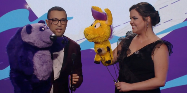 Two performers utilizing puppets announce an award for gay teen romance "Heartstopper" at the first annual Children's and Family Emmy awards. 