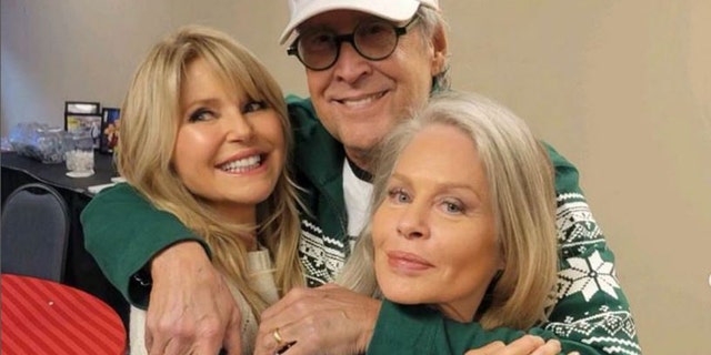 Christie Brinkley, Chevy Chase and Beverly D'Angelo smile while backstage for a 