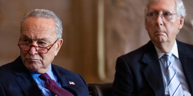 From left, Senate Majority Leader Chuck Schumer, D-N.Y., and Senate Minority Leader Mitch McConnell, R-Ky., attend the Congressional Gold Medal Ceremony in the Capitol Rotunda on Tuesday, Dec. 6, 2022.