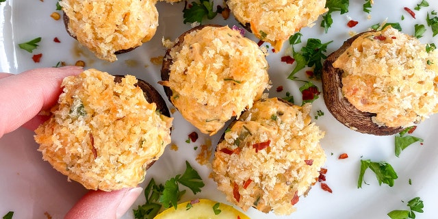 Delicious crab cake stuffed mushroom caps: Enjoy this modern twist on a classic appetizer.