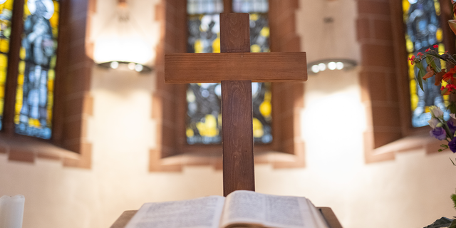 A wooden cross stands on the altar in the Lutheran Old St. Nicholas Church in Frankfurt, Germany, Nov. 23, 2022.