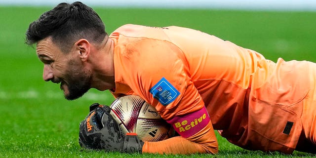 France's goalkeeper Hugo Lloris embraces the ball during the World Cup semifinal soccer match between France and Morocco at the Al Bayt Stadium in Al Khor, Qatar, Wednesday, Dec. 14, 2022. 