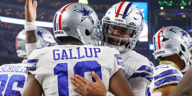 Dak Prescott #4 of the Dallas Cowboys celebrates with Michael Gallup #13 of the Dallas Cowboys after a touchdown in the second quarter of a game Indianapolis Colts at AT&amp;T Stadium on December 04, 2022, in Arlington, Texas.