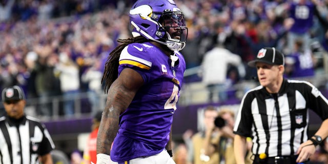 Dalvin Cook of the Minnesota Vikings celebrates after rushing for a touchdown against the Indianapolis Colts during the fourth quarter of a game at U.S. Bank Stadium Dec. 17, 2022, in Minneapolis.
