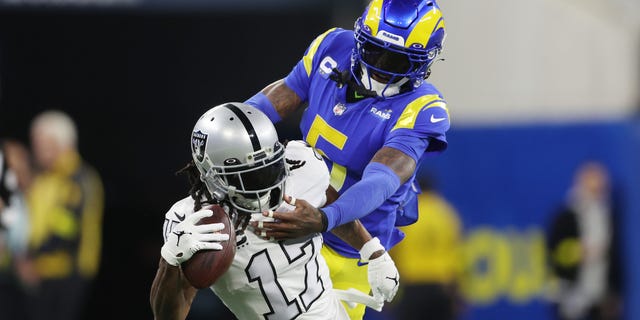 Davante Adams #17 of the Las Vegas Raiders makes a reception against Jalen Ramsey #5 of the Los Angeles Rams during the first quarter at SoFi Stadium on December 8, 2022, in Inglewood, California.