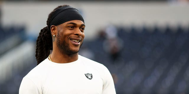 Davante Adams #17 of the Las Vegas Raiders smiles prior to an NFL football game against the Los Angeles Rams at SoFi Stadium on December 8, 2022, in Inglewood, California.