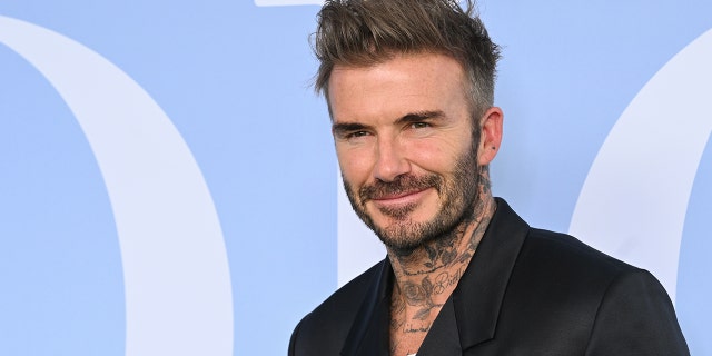 David Beckham posing for a photo