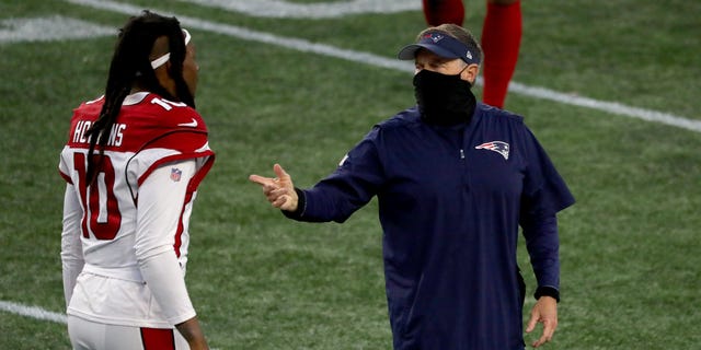 Head coach Bill Belichick of the New England Patriots talks with DeAndre Hopkins #10 of the Arizona Cardinals after the game at Gillette Stadium on November 29, 2020 in Foxborough, Massachusetts.