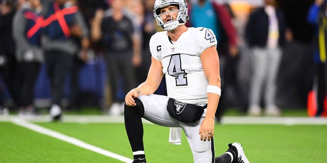 Las Vegas Raiders quarterback Derek Carr, #4, reacts to throwing an interception during the NFL game between the Las Vegas Raiders and the Los Angeles Rams on Dec. 8, 2022, at SoFi Stadium in Inglewood, California.