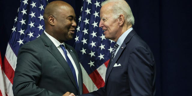 President Biden greets Jaime Harrison, chairman of the Democratic National Committee, at the organization's summer meeting on Sept. 8, 2022, in National Harbor, Maryland.
