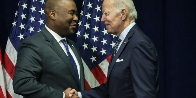 President Biden greets Jaime Harrison, chairman of the Democratic National Committee, at the organization's summer meeting on Sept. 8, 2022, in National Harbor, Maryland.