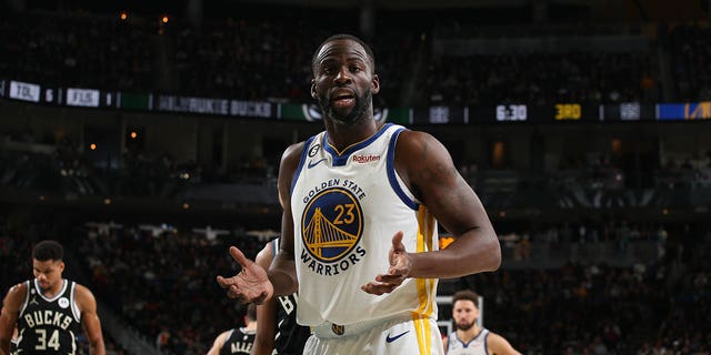 Draymond Green #23 of the Golden State Warriors looks on during the game against the Milwaukee Bucks on December 13, 2022, at the Fiserv Forum Center in Milwaukee, Wisconsin. 