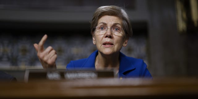 Massachusetts Senator Elizabeth Warren asks questions during a Senate Banking Committee hearing on FTXs collapse