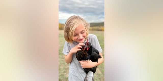 Clark's son Fin, who is nine years old, loves to help out around the farm. 