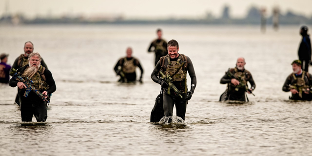 Participants in the Frogman Swim traverse 3.4 miles of the 55-degree Tampa Bay.