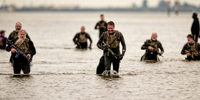 Participants in the Frogman Swim traverse 3.4 miles of the 55-degree Tampa Bay.