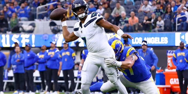Geno Smith of the Seattle Seahawks throws a pass during the second quarter against the Los Angeles Rams at SoFi Stadium, Dec. 4, 2022, in Inglewood, California.