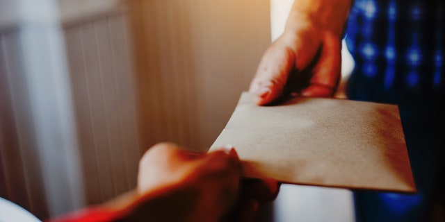 Adam Adkisson was able to return the envelope to its owner the next day thanks to Alissa Rocchi's investigative work.