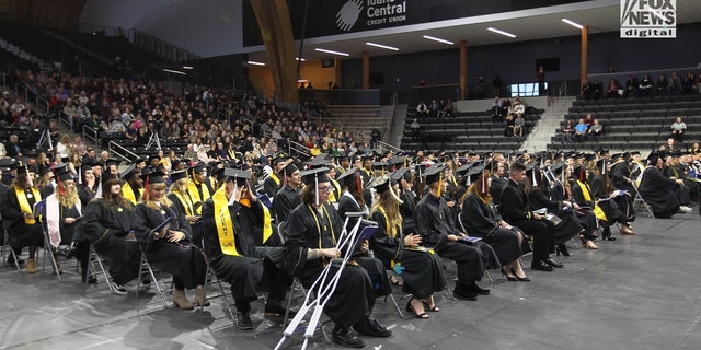 Fall graduates from the University of Idaho sit at their commencement ceremony on Saturday, Dec. 10, 2022. An estimated 25% to 40% of the school's 11,500-person population did not return to in-person learning after Thanksgiving following the unsolved slayings of four students at a house just steps off campus.