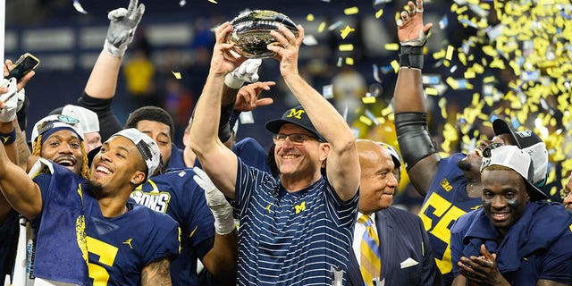 Michigan Wolverines head coach Jim Harbaugh celebrates after the Big 10 championship game against the Purdue Boilermakers on December 3, 2022, at Lucas Oil Stadium in Indianapolis. 