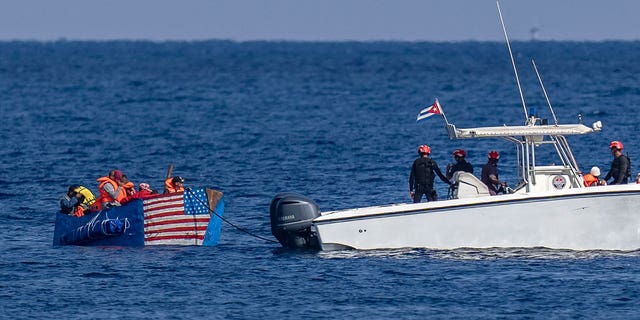A ramshackle raft bearing an American flag was intercepted by Cuban authorities in plain sight off the coast of the nation's capital, Havana.