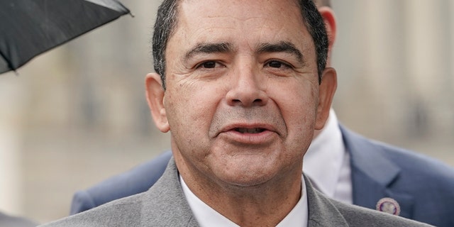 Rep. Henry Cuellar, D-Texas, center, speaks during a news conference on rising suicide rates at the U.S. Border Patrol, Wednesday, Dec. 7, 2022, on Capitol Hill in Washington.