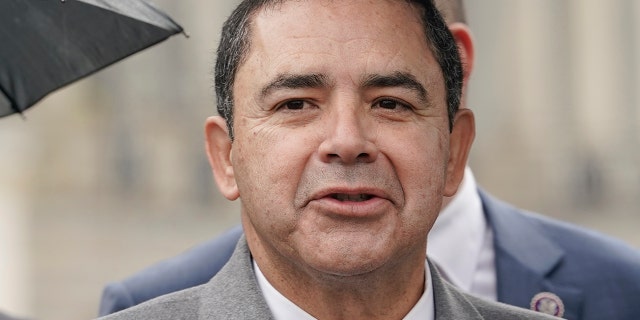 Rep. Henry Cuellar, D-Texas, center, speaks during a news conference on rising suicide rates at the U.S. Border Patrol, Wednesday, Dec. 7, 2022, on Capitol Hill in Washington.