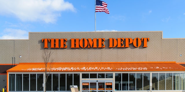 Home Depot employees, Alissa Rocchi and Adam Adkisson, work together to find the owner of a cash-filled envelop found on the floor of an aisle.