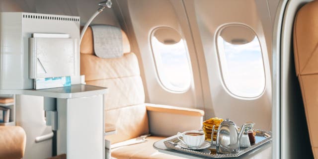 First-class seats are typically larger than coach and have more legroom and space to recline. 