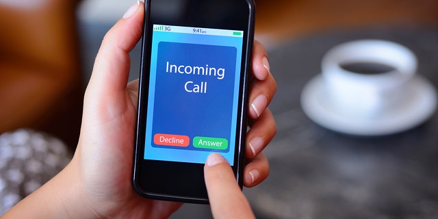 An incoming call pops up on a smart phone.