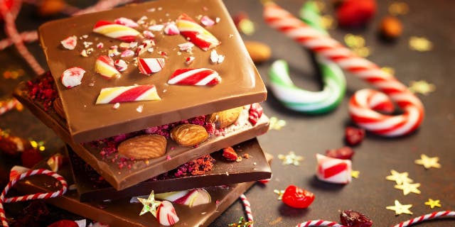 Peppermint bark and candy canes are usually thought of as popular Christmas candies, but this year's ‘Most Popular Christmas Candy By State’ survey from CandyStore.com will surprise you.