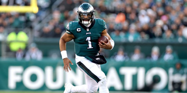 Jalen Hurts #1 of the Philadelphia Eagles runs with the ball in the third quarter of a game against the Tennessee Titans at Lincoln Financial Field on December 4, 2022 in Philadelphia, Pennsylvania.