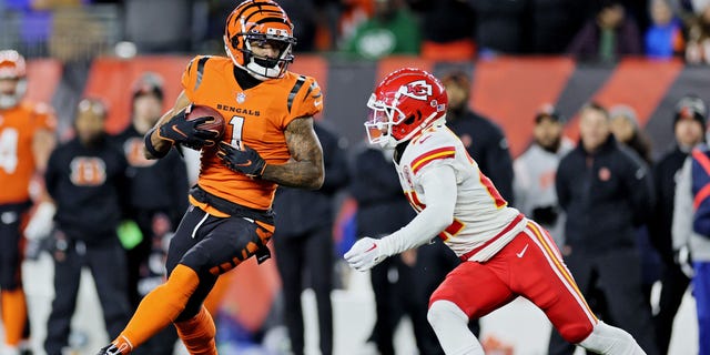 Ja'Marr Chase of the Cincinnati Bengals, left, carries the ball against the Kansas City Chiefs during the second half at Paycor Stadium on Dec. 4, 2022, in Cincinnati.