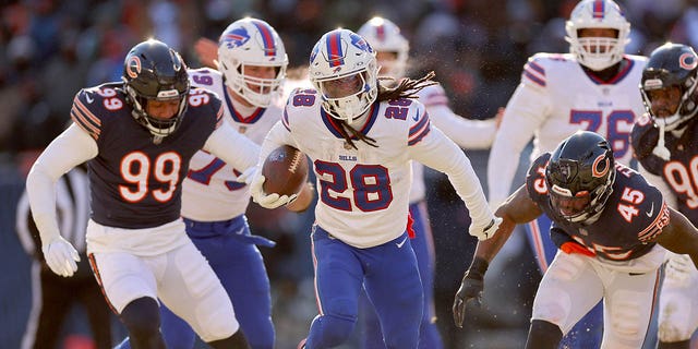 James Cook #28 of the Buffalo Bills runs for a touchdown against the Chicago Bears during the third quarter of the game at Soldier Field on December 24, 2022 in Chicago, Illinois. 