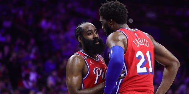 James Harden and Joel Embiid of the 76ers speak during the LA Clippers game at Wells Fargo Center on Dec. 23, 2022, in Philadelphia.