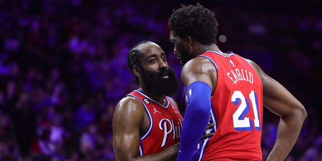 James Harden and Joel Embiid of the 76ers speak during the LA Clippers game at Wells Fargo Center on Dec. 23, 2022, in Philadelphia.