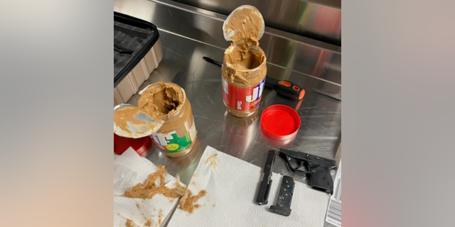 A Rhode Island man tried to hide gun parts in jars of peanut butter.