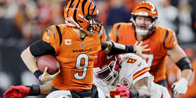 Joe Burrow of the Cincinnati Bengals carries the ball against the Kansas City Chiefs during the second half at Paycor Stadium on Dec. 4, 2022, in Cincinnati.