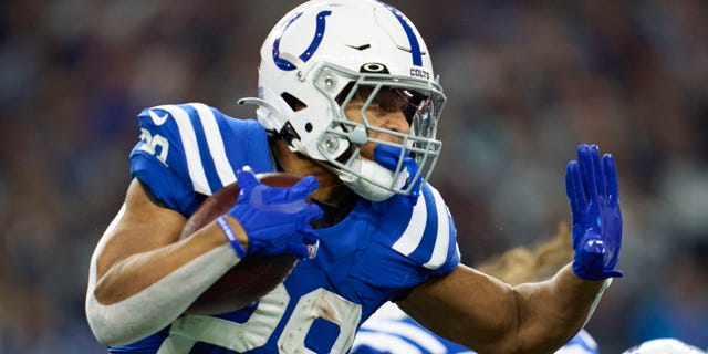 Jonathan Taylor, #28 of the Indianapolis Colts, carries the ball against the Dallas Cowboys during the first half at AT&amp;T Stadium on Dec. 4, 2022 in Arlington, Texas.